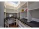 Spacious walk-in pantry with custom shelving and built-in wine rack and counter space at 2012 Longmont Dr, Wake Forest, NC 27587