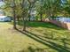 Large backyard with mature trees offering shade and a sense of privacy at 206 Mansfield Dr, Broadway, NC 27505