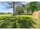 Large backyard with mature trees providing shade and a peaceful ambiance at 206 Mansfield Dr, Broadway, NC 27505