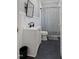 Bathroom featuring modern fixtures, a sink, and a shower with gray tiling at 206 Mansfield Dr, Broadway, NC 27505