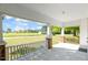 Charming front porch with white railings and brick columns offers a relaxing outdoor space at 206 Mansfield Dr, Broadway, NC 27505