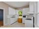 Bright kitchen with white appliances and plenty of cabinet space at 206 Mansfield Dr, Broadway, NC 27505