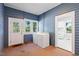 Laundry room with washer, dryer, and outdoor access through a white frame glass paneled door at 206 Mansfield Dr, Broadway, NC 27505