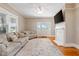 Bright living room with fireplace and doors leading to the outdoors at 206 Mansfield Dr, Broadway, NC 27505