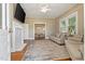 Inviting living room with hardwood floors, fireplace, and plenty of natural light at 206 Mansfield Dr, Broadway, NC 27505