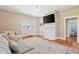 Cozy living room with fireplace and access to a bathroom at 206 Mansfield Dr, Broadway, NC 27505