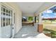 Inviting porch with classic columns and a view of the surrounding neighborhood at 206 Mansfield Dr, Broadway, NC 27505