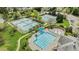 Aerial view of the neighborhood pool, tennis courts, playground, and manicured green spaces at 211 Kurtner Ct, Morrisville, NC 27560