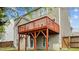 Exterior view of a two-story home featuring a wood deck and private yard at 211 Kurtner Ct, Morrisville, NC 27560