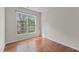 Bright bedroom with hardwood floors and large window with natural sunlight at 211 Kurtner Ct, Morrisville, NC 27560
