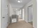 Upstairs hallway with carpeted floors and several doors to different rooms at 211 Kurtner Ct, Morrisville, NC 27560
