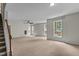 Spacious living room with plush carpet, neutral walls and windows providing lots of light at 211 Kurtner Ct, Morrisville, NC 27560