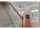 Cozy living room with fireplace, hardwood floors, ceiling fan, and natural lighting at 211 Kurtner Ct, Morrisville, NC 27560