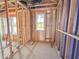 Bright interior framing with a view through windows, showing the structural framework and the space's potential layout at 221 Pond View Ct # 9, Fuquay Varina, NC 27526