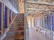 Interior view of unfinished staircase showing the structure and space ready for customization and finishing at 221 Pond View Ct # 9, Fuquay Varina, NC 27526
