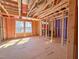 Sunlit interior framing with open space and windows, showcasing the home's structure and future layout at 221 Pond View Ct # 9, Fuquay Varina, NC 27526