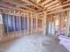 Unfinished interior featuring wooden framing, visible utilities, and open layout with the possibility for custom design at 221 Pond View Ct # 9, Fuquay Varina, NC 27526