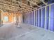 Spacious, unfinished room with wood framing, ready for customization and featuring rough-in for electrical and plumbing at 221 Pond View Ct # 9, Fuquay Varina, NC 27526