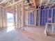 Under construction view of the home's framing with a door and windows looking out to the exterior at 221 Pond View Ct # 9, Fuquay Varina, NC 27526