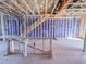 Under construction view of the home's framing with electrical wires and plumbing at 221 Pond View Ct # 9, Fuquay Varina, NC 27526