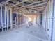 Under construction view of the home's framing with electrical wires and plumbing at 221 Pond View Ct # 9, Fuquay Varina, NC 27526