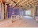 Under construction view of the home's framing with windows looking out to the exterior at 221 Pond View Ct # 9, Fuquay Varina, NC 27526