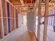House frame in construction with two open doorways visible and wiring being installed at 221 Pond View Ct # 9, Fuquay Varina, NC 27526