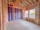 Bare room framing with visible house wrap and stud work, ready for wiring and insulation at 221 Pond View Ct # 9, Fuquay Varina, NC 27526
