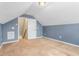 Spacious attic area with carpet and an open doorway with stairs going to another floor at 223 Triumph Dr, Elon, NC 27244