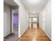 Bright hallway with hardwood floors leads to the open living area, creating a welcoming entrance at 223 Triumph Dr, Elon, NC 27244
