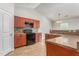 Well-equipped kitchen featuring ample cabinet space, tile backsplash, and eat-in breakfast bar, ideal for cooking at 223 Triumph Dr, Elon, NC 27244
