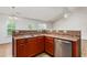 A well-equipped kitchen features stainless steel appliances and double sinks with natural light at 223 Triumph Dr, Elon, NC 27244
