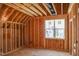 Bedroom under construction, framing, window, and flooring, for future finishing at 2328 Ballywater Lea Way, Wake Forest, NC 27587