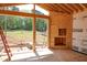 Living room under construction with window view, framed wood, and interior fireplace feature at 2328 Ballywater Lea Way, Wake Forest, NC 27587