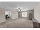 Spacious bedroom with neutral walls, carpet, ceiling fan, and multiple entrances at 24 Kaki Ct, Selma, NC 27576