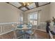 A dining room featuring a decorative wood ceiling, wood floors, and a round table with four chairs and lots of natural light at 24 Kaki Ct, Selma, NC 27576