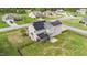 Exterior of a home with solar panels, a screened in porch, and large fenced in yard at 24 Kaki Ct, Selma, NC 27576