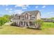 Charming two-story home features a covered front porch and well-manicured lawn, creating an inviting curb appeal at 24 Kaki Ct, Selma, NC 27576