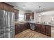 Well-equipped kitchen featuring stainless steel appliances, granite countertops, and ample cabinet space at 24 Kaki Ct, Selma, NC 27576
