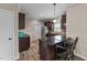 A kitchen featuring wood cabinets, stainless steel appliances, granite countertops, and a cozy breakfast bar with chairs at 24 Kaki Ct, Selma, NC 27576