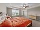 A large main bedroom featuring a decorative ceiling with a ceiling fan, two side tables, and a dresser at 24 Kaki Ct, Selma, NC 27576
