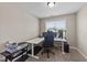 Bright office with a window and desk, illuminated with overhead lighting at 24 Kaki Ct, Selma, NC 27576