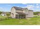Back exterior view of home featuring a screened-in porch and solar panels at 24 Kaki Ct, Selma, NC 27576