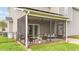 Relaxing screened-in porch with comfortable seating, perfect for enjoying the outdoors at 24 Kaki Ct, Selma, NC 27576