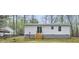 Rear view of house showing sliding glass door leading to backyard with stairs at 25 Beechnut Ct, Franklinton, NC 27525