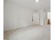 An airy bedroom with neutral carpet and ample natural light through the open door at 25 Beechnut Ct, Franklinton, NC 27525