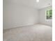 Bright bedroom with neutral carpet, a window view, and electrical outlets ready for use at 25 Beechnut Ct, Franklinton, NC 27525