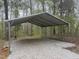 A sturdy carport stands ready to protect vehicles from the elements at 25 Beechnut Ct, Franklinton, NC 27525