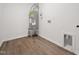 Compact utility area with a water heater and laminate flooring, designed for functionality at 25 Beechnut Ct, Franklinton, NC 27525