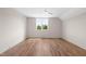 Bedroom with hardwood floors, ceiling fan, and a bright window with nature views at 250 Pilot Ridge Rd, Zebulon, NC 27597